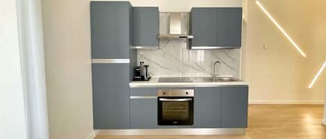 Deluxe Apartment, City View | Private kitchen | Full-size fridge, oven, stovetop, espresso maker