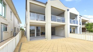 A modern multi-story building with balconies, large windows, and a flat roof. - The Cove, Port Hughes (Port Hughes)