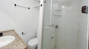 Bathroom features a white sink, granite countertop, and glass shower enclosure.