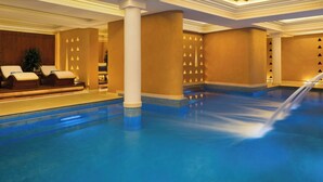 A swimming pool area with lounge chairs and a water feature. - Bab Samhan, A Luxury Collection Hotel, Diriyah (Diryah)