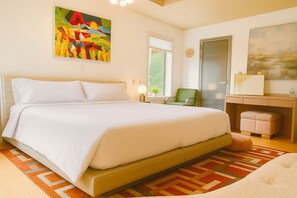 A bedroom with a large bed, a desk, a chair, and a painting on the wall. - Sunny Peace Homestay (Harwinton)