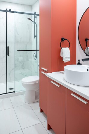 Shower, hair dryer, towels, toilet paper