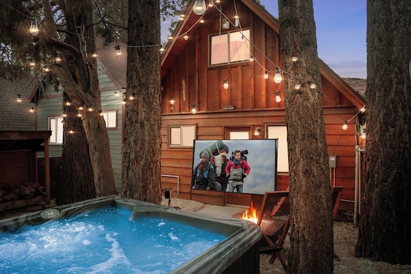 Enjoy a movie under the lights and the stars or relaxing in the hot tub.