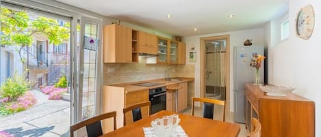 Fridge, stovetop, cookware/dishes/utensils