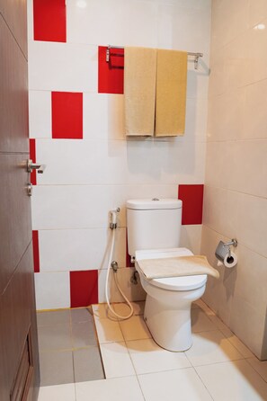 Shower, slippers, bidet, towels