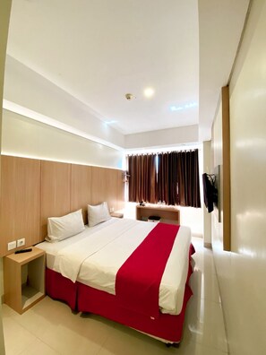 Coffres-forts dans les chambres, bureau, fer et planche à repasser