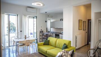 Apartment, 2 Bedrooms, Balcony | Living area | Flat-screen TV