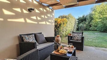 Apartment, 1 Bedroom, Pool Access | Living area | 32-inch flat-screen TV with cable channels