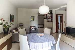 Apartment, 2 Bedrooms, Balcony | Living area | Flat-screen TV