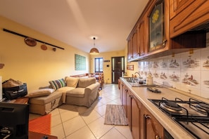 House, 1 Bedroom, Balcony | Private kitchen | Full-size fridge, microwave, oven, stovetop