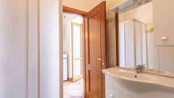 Apartment, 2 Bedrooms, Balcony | Bathroom | Shower, hair dryer, towels