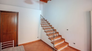A staircase with patterned steps and a wooden door. - La Discesa Di San Giuseppe (Termini Imerese)