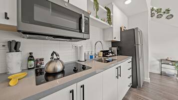 Fridge, microwave, stovetop, coffee/tea maker