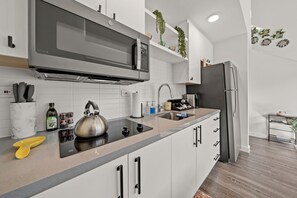 Fridge, microwave, stovetop, coffee/tea maker