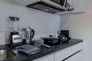 Fridge, microwave, stovetop, coffee/tea maker