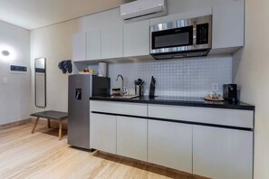 Fridge, microwave, stovetop, coffee/tea maker