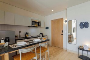 Fridge, microwave, stovetop, coffee/tea maker