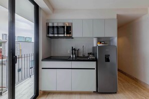 Fridge, microwave, stovetop, coffee/tea maker