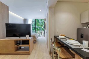 1 bedroom, desk, iron/ironing board, travel crib