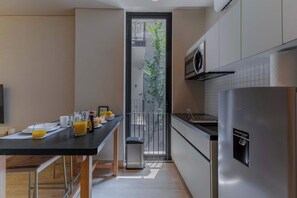 Fridge, microwave, stovetop, coffee/tea maker