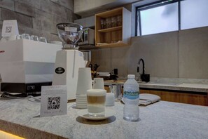 Fridge, microwave, stovetop, coffee/tea maker