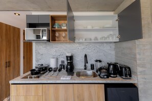 Fridge, microwave, stovetop, coffee/tea maker