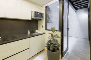 Fridge, microwave, stovetop, coffee/tea maker