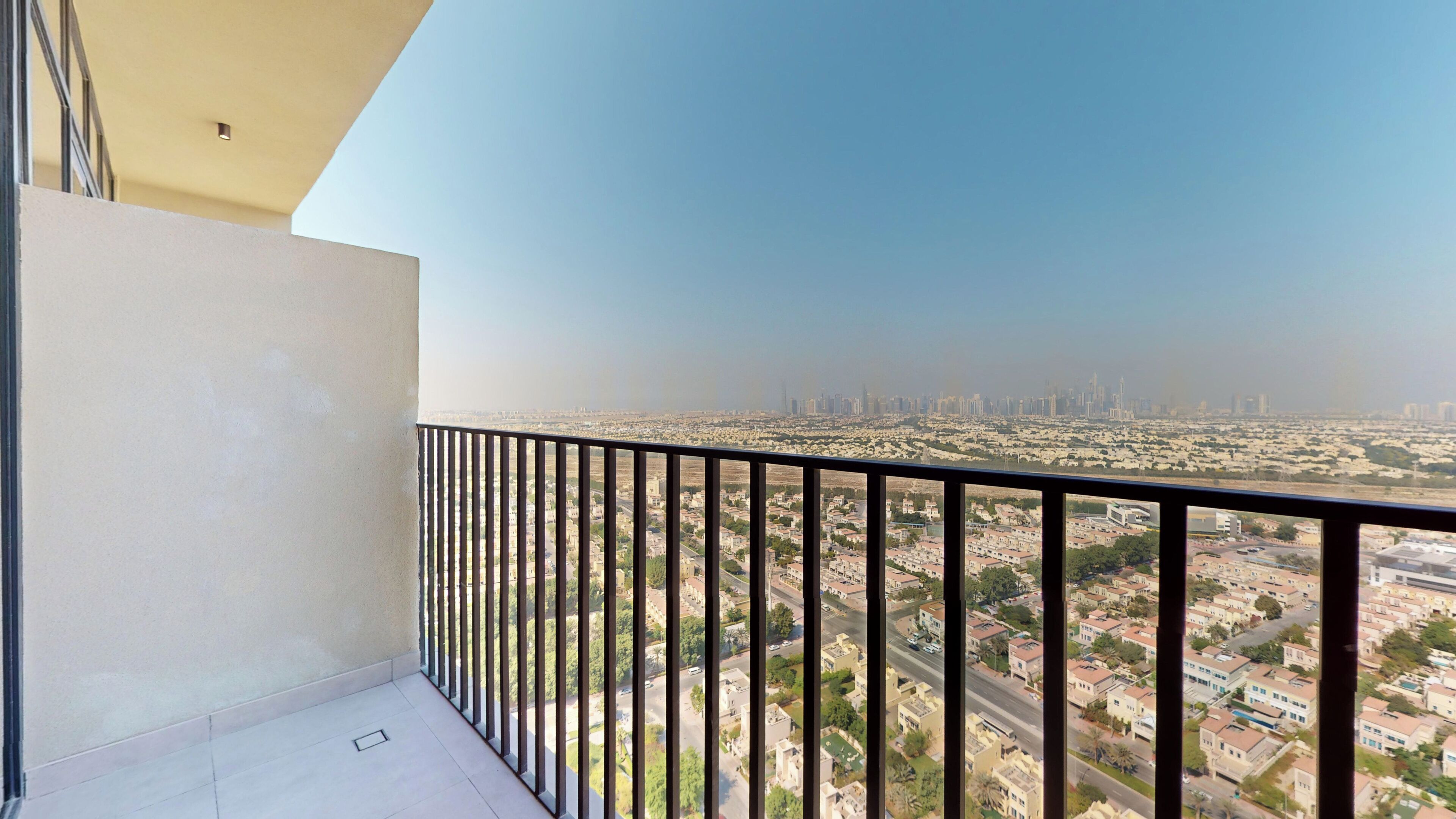 A balcony with a view of a cityscape.