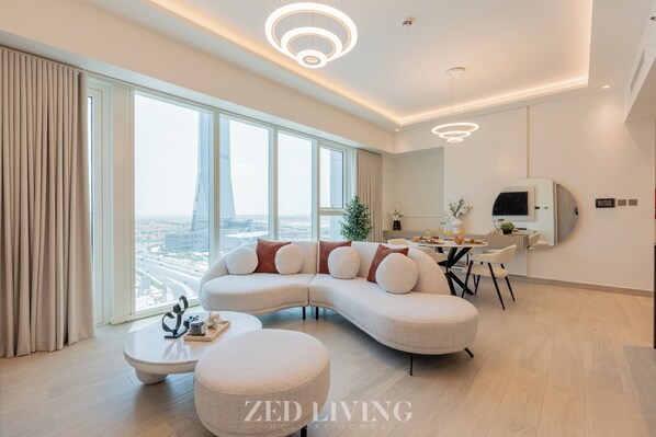 Family Apartment, 1 Bedroom | Living area | 55-inch TV with satellite channels