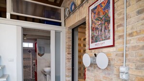 A modern interior with a staircase, a bathroom with patterned tiles, and a framed artwork on the wall. - Wonderful  villa with WIFI, private pool, A/C, hot tub, patio, pets allowed and panoramic view (Città Sant'angelo)