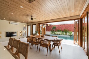 Deluxe Villa, 3 Bedrooms, Balcony, Pool View | Living area | 64-inch Smart TV with digital channels - Copper Estate 1 by Alfred in Bali (Canggu)
