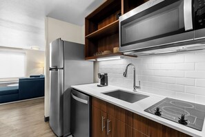 Suite, 1 King Bed, Non Smoking | Private kitchen | Full-size fridge, stovetop, dishwasher, toaster
