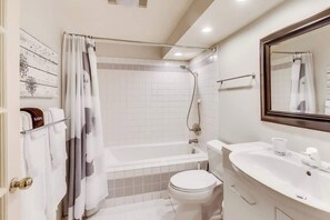 Shower, hair dryer, towels, shampoo