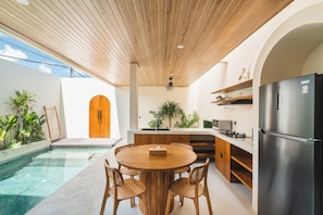 Deluxe Villa, Balcony, Pool View | Dining room
