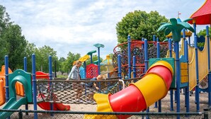 A playground with various play structures including slides and climbing areas. - Hikers Cabin in Maurik (Maurik)