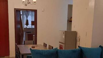 Deluxe Apartment, Balcony, City View | Living area | 24-inch Smart TV with digital channels