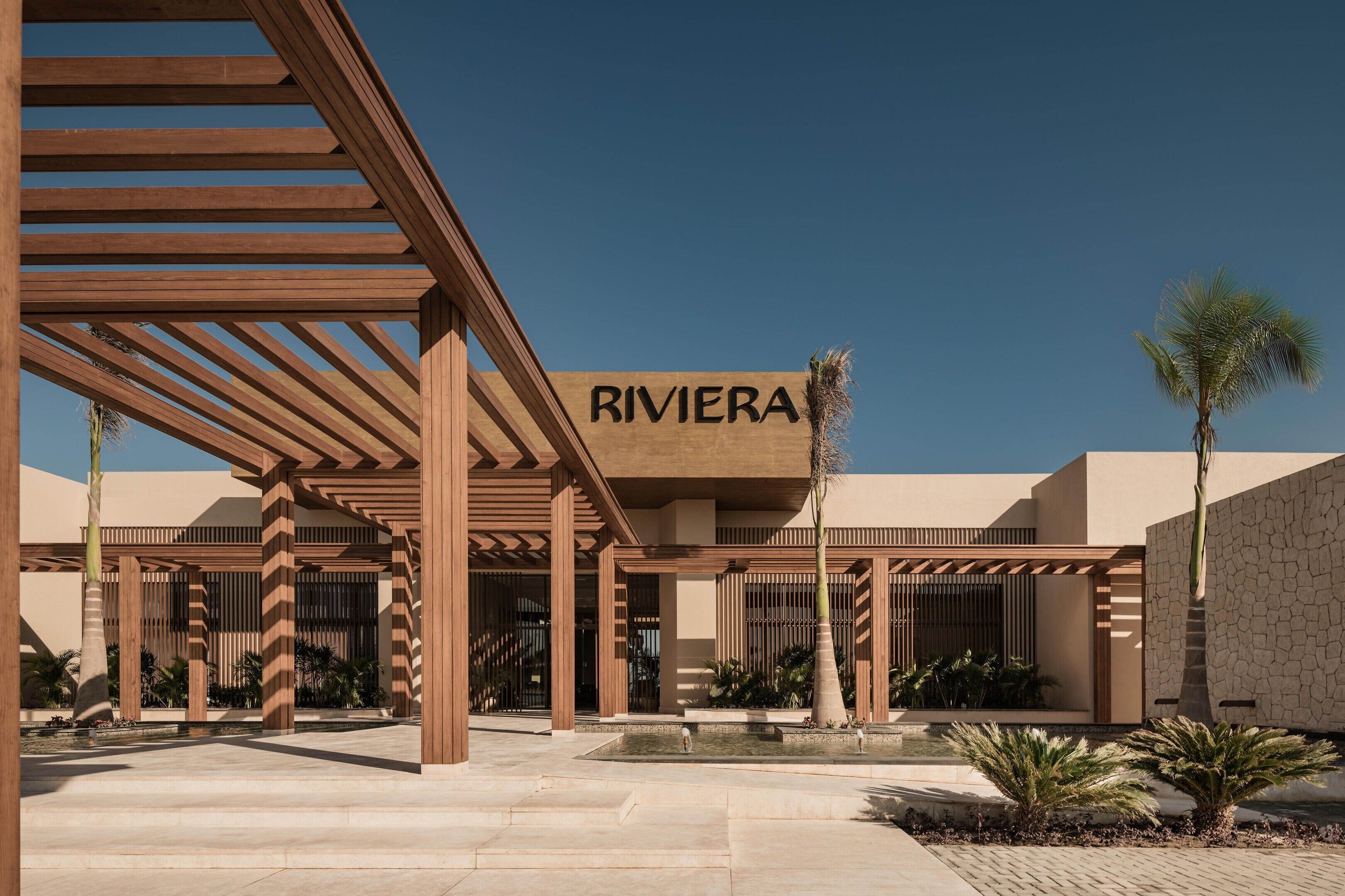 A modern building with a sign that reads 'RIVIERA'.