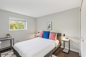 1 bedroom, desk, iron/ironing board, travel crib