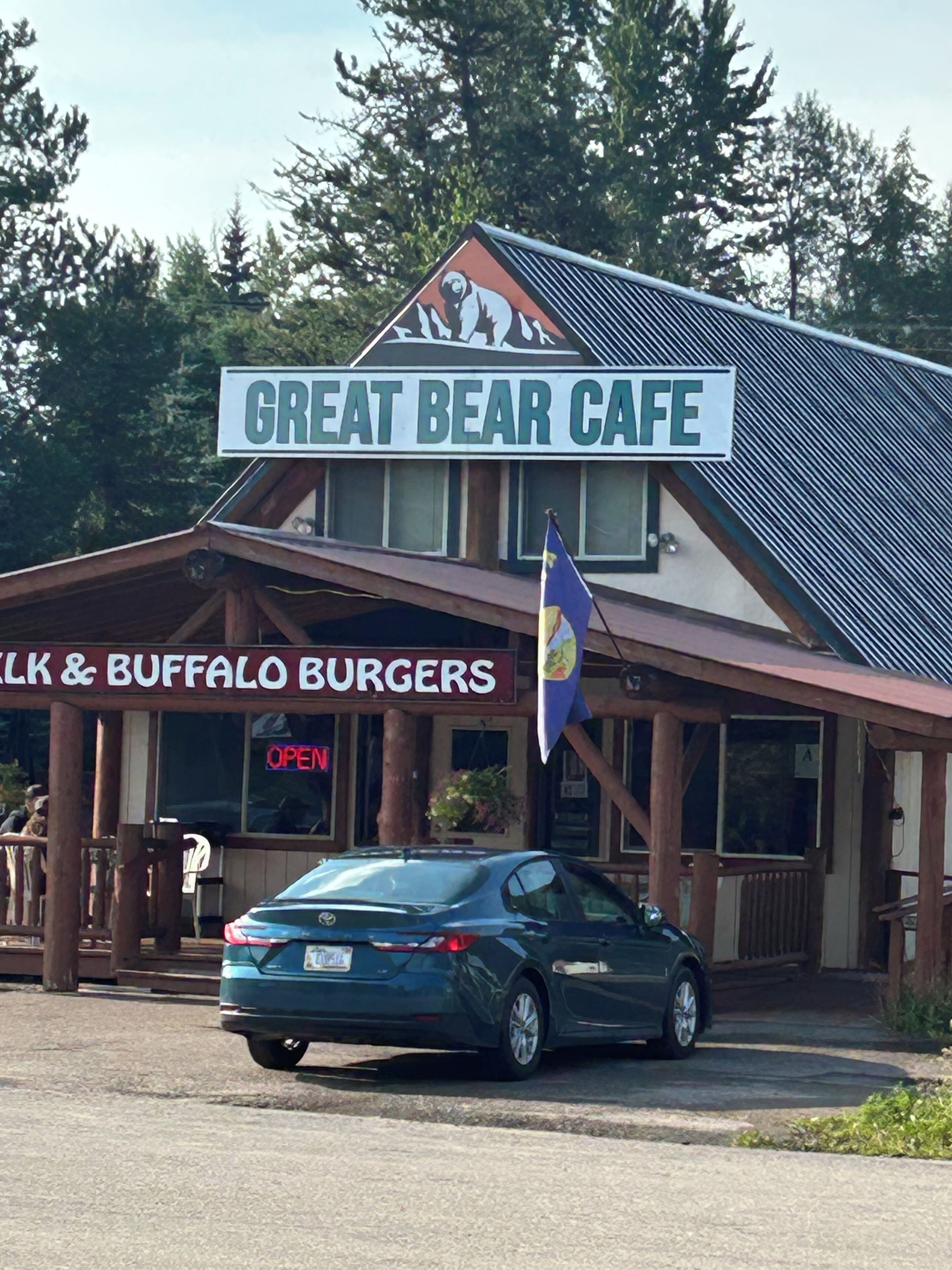 A building with a sign reading 'GREAT BEAR CAFE' and 'BUFFALO BURGERS' below.