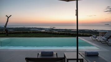 Seasonal outdoor pool, pool umbrellas, pool loungers