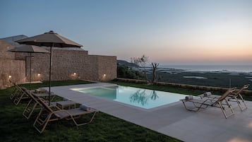 Seasonal outdoor pool, pool umbrellas, pool loungers