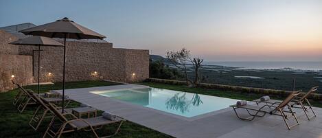 Seasonal outdoor pool, pool umbrellas, pool loungers