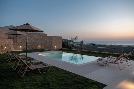 Seasonal outdoor pool, pool umbrellas, sun loungers