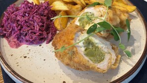 A plate with a breaded fish fillet, French fries, and red cabbage. - Magiczna Farma Mąka i Magia  (Zambrów)