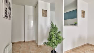 Comfort Apartment, Garden View | Living area | 80-cm flat-screen TV with digital channels, TV