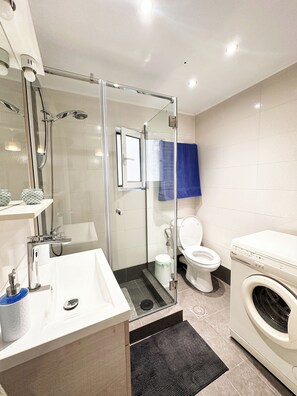 Shower, hair dryer, towels, soap