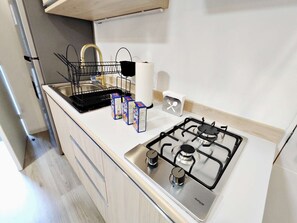 Fridge, microwave, stovetop, coffee/tea maker