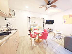 Enjoy a spacious room with a dining area, kitchenette, and comfortable living space.