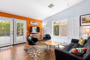 Smart TV, fireplace, books, printers