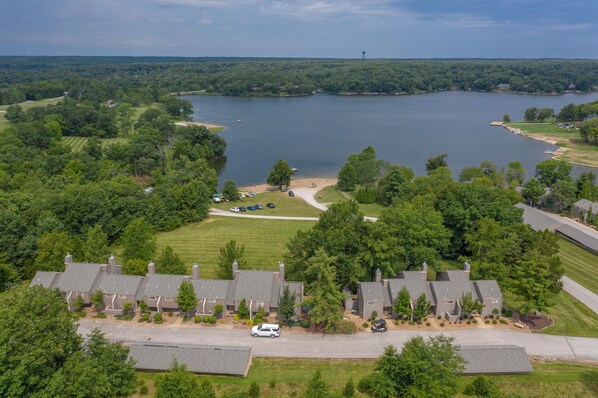 A residential area with houses, a lake, and a golf course.